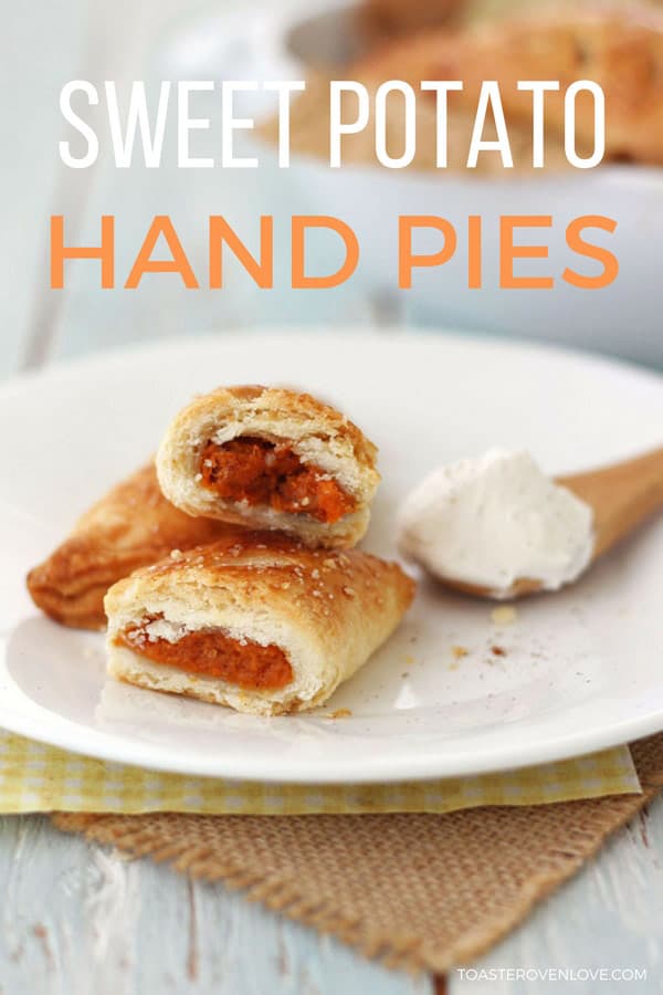 Mini hand pie on a white plate with whipped cream.