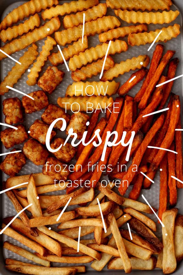 A variety of baked french fries and tater tots on a sheet pan.