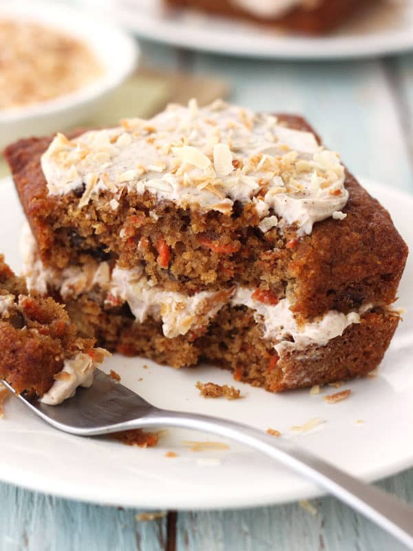 Mini carrot cake on a white plate with a fork.