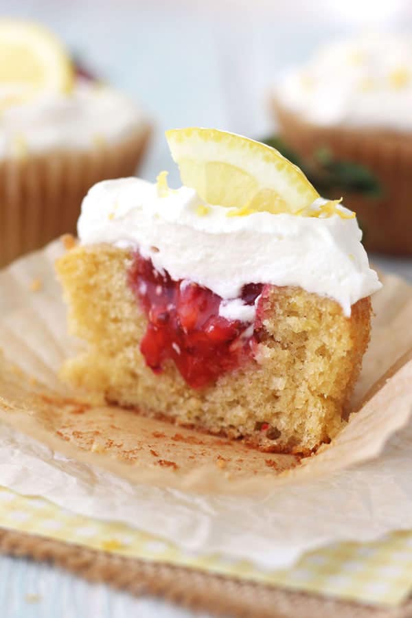 Lemon cupcake with strawberry filling and whipped cream. 