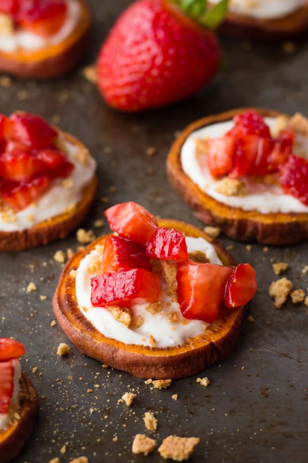 Chopped strawberries and cheesecake mixture on baked sweet potato slices.