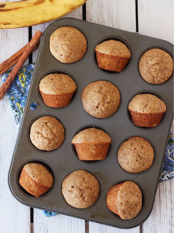 twelve baked mini muffins in a tin