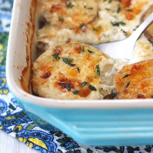 Spoon scooping into casserole dish.