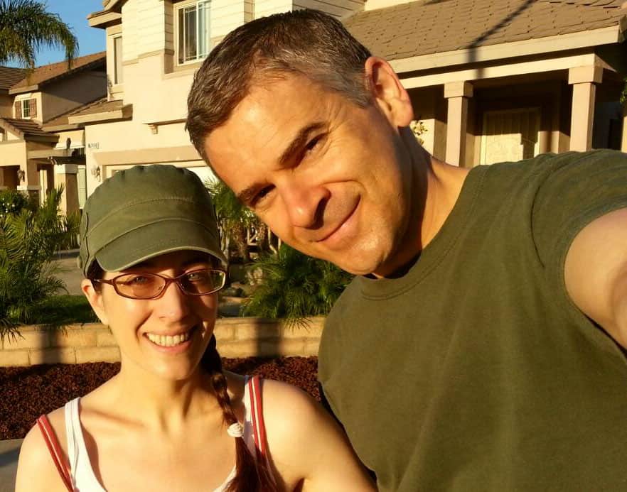 Couple in front of a house.