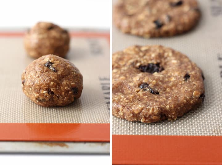 Balls of cookie dough patted down on a sheet pan.