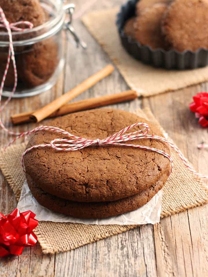 Two large molasses cookies tied with twine.