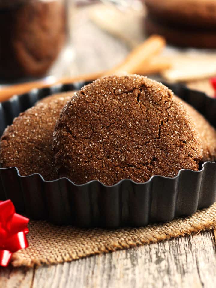 Closeup of dark molasses cookies with sparkly sugar exteriors.