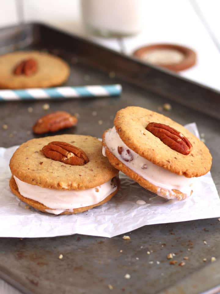 Two mini ice cream sandwiches on a baking sheet.