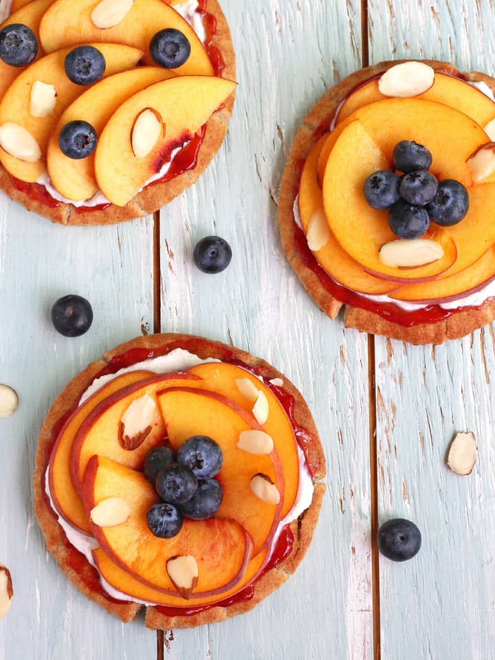 Overhead view of peach topped pitas.