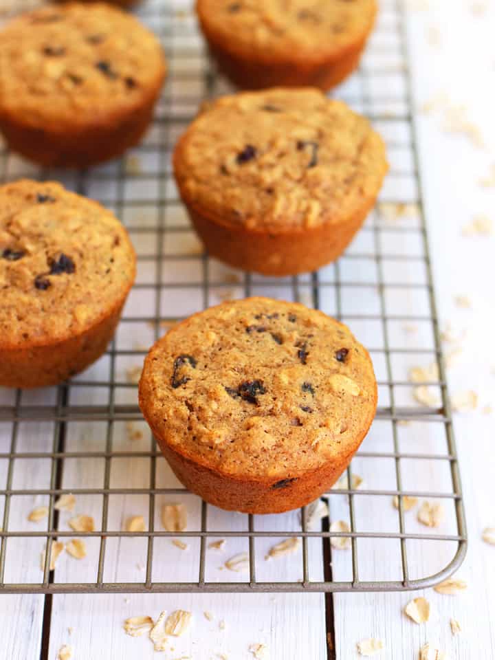 Oatmeal raisin muffins on a cooling rack.