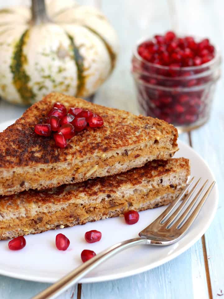 Stuffed french toast topped with pomegranate seeds.