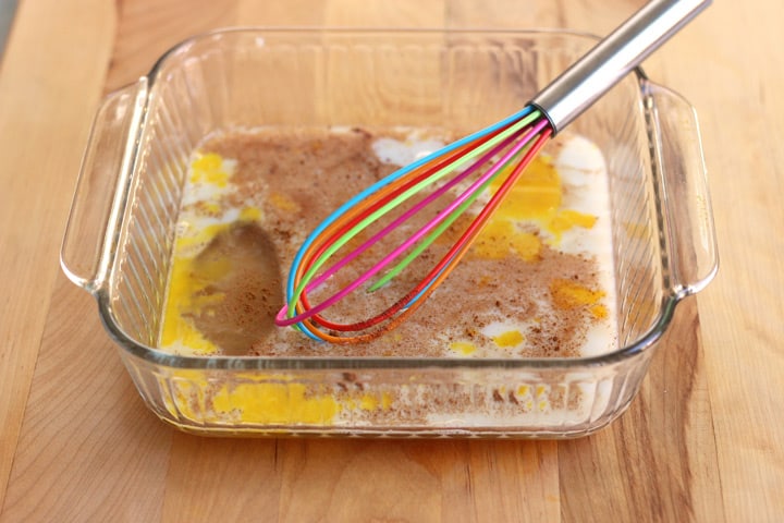 Custard mixture whisked in a baking dish.