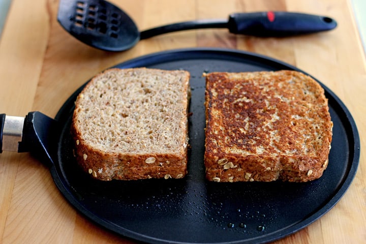 French toast baked on a dark skillet.