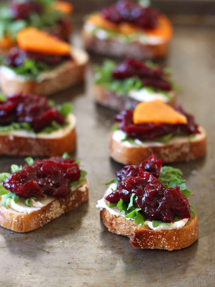 Toasted crostini topped with goat cheese and roasted cranberries.