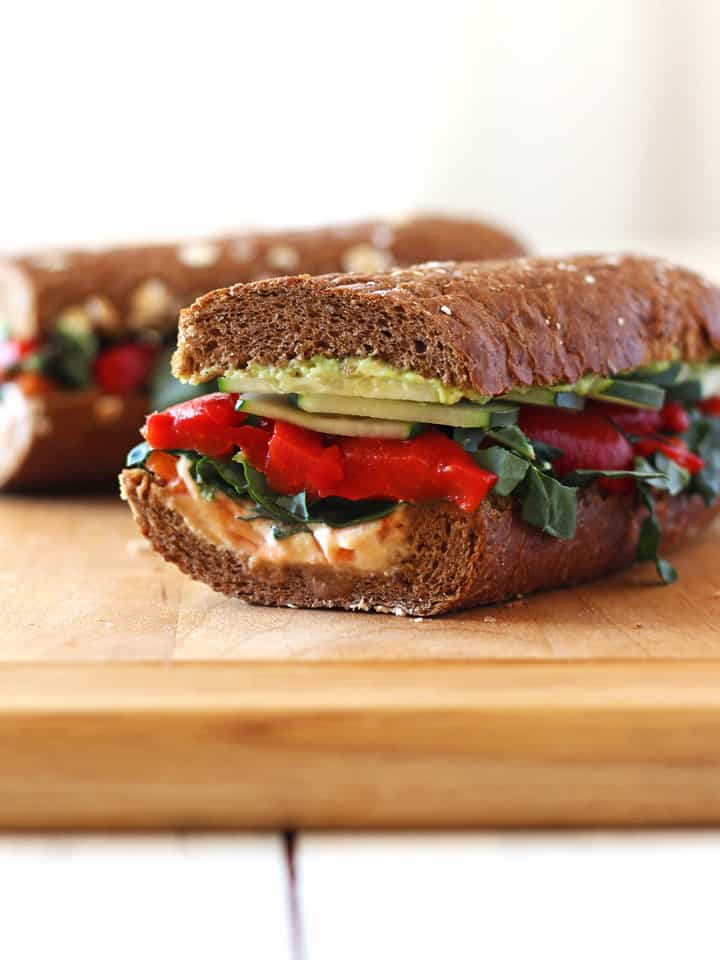 Whole grain baguette layered with hummus, avocado and fresh veggies.