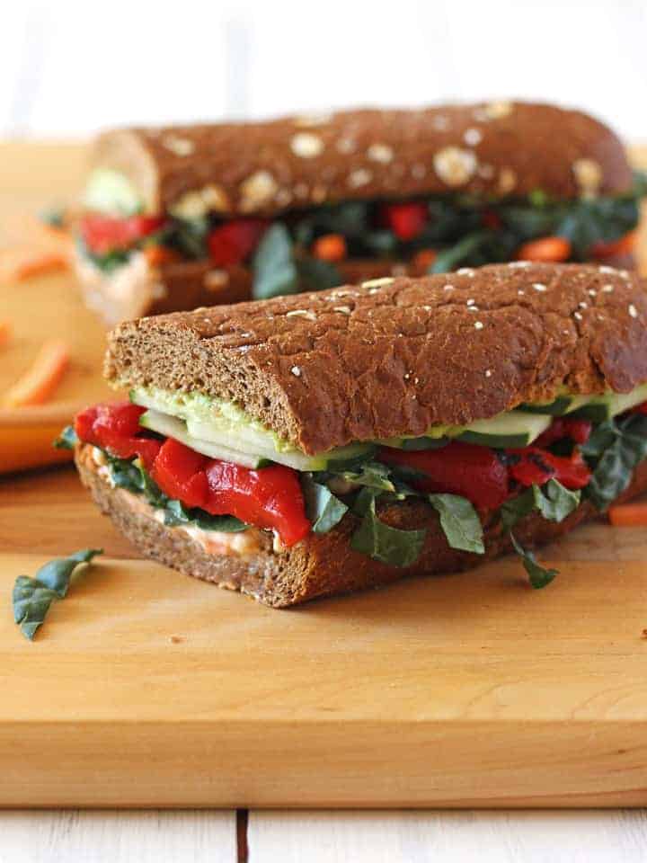 Two sandwich halves on a cutting board.