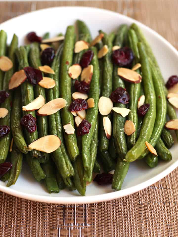 Roasted green peans with toasted nuts and dried cranberries.