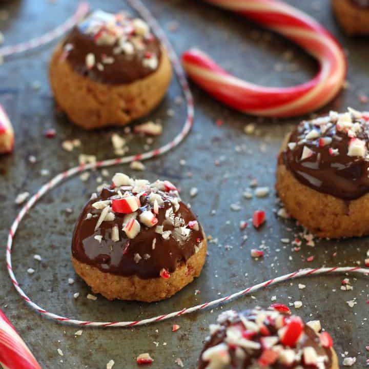 Sheet pan with cookies and candy canes.