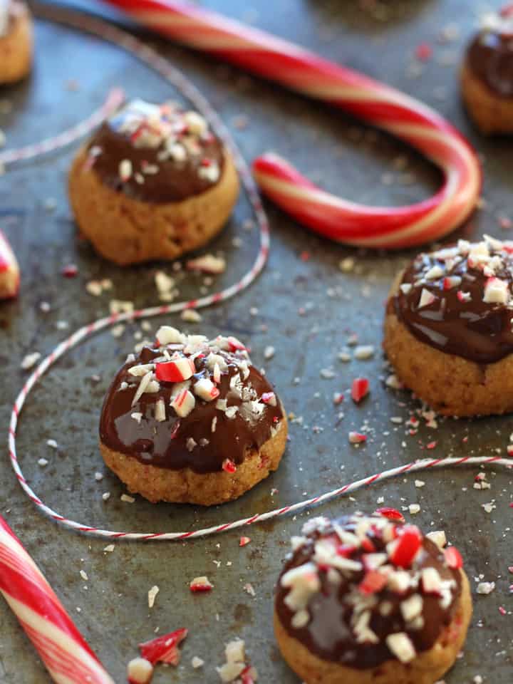 Sheet pan with cookies and candy canes.