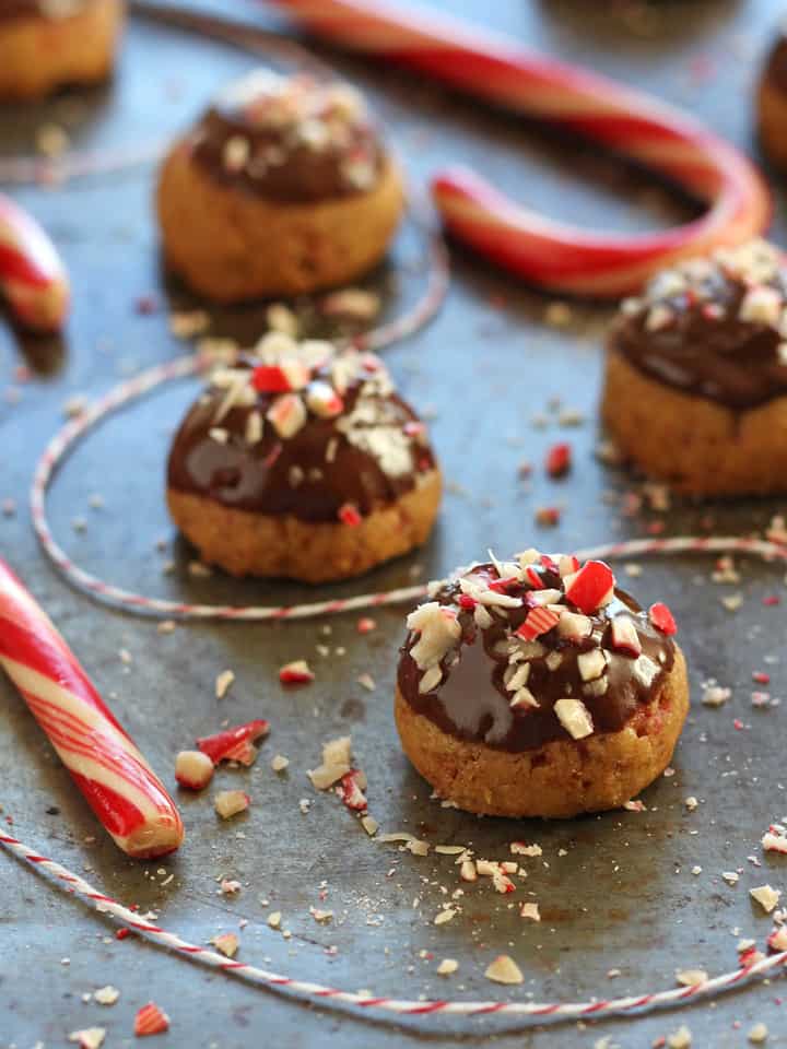 Cookies topped with melted chocolate and crushed peppermint.