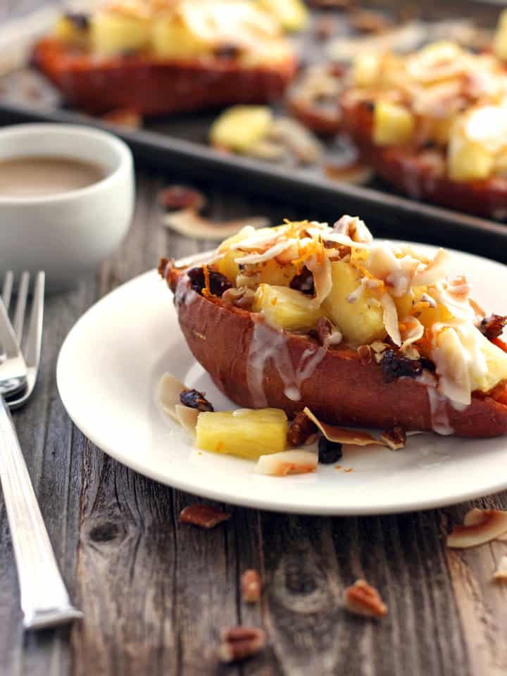 Vegan Twice-Baked Sweet Potatoes with Pineapple and Coconut. Toaster oven sweet potatoes baked to perfection, topped with juicy pineapple and toasted coconut. Treat yourself to these rich and creamy dairy-free twice-baked sweet potatoes today!