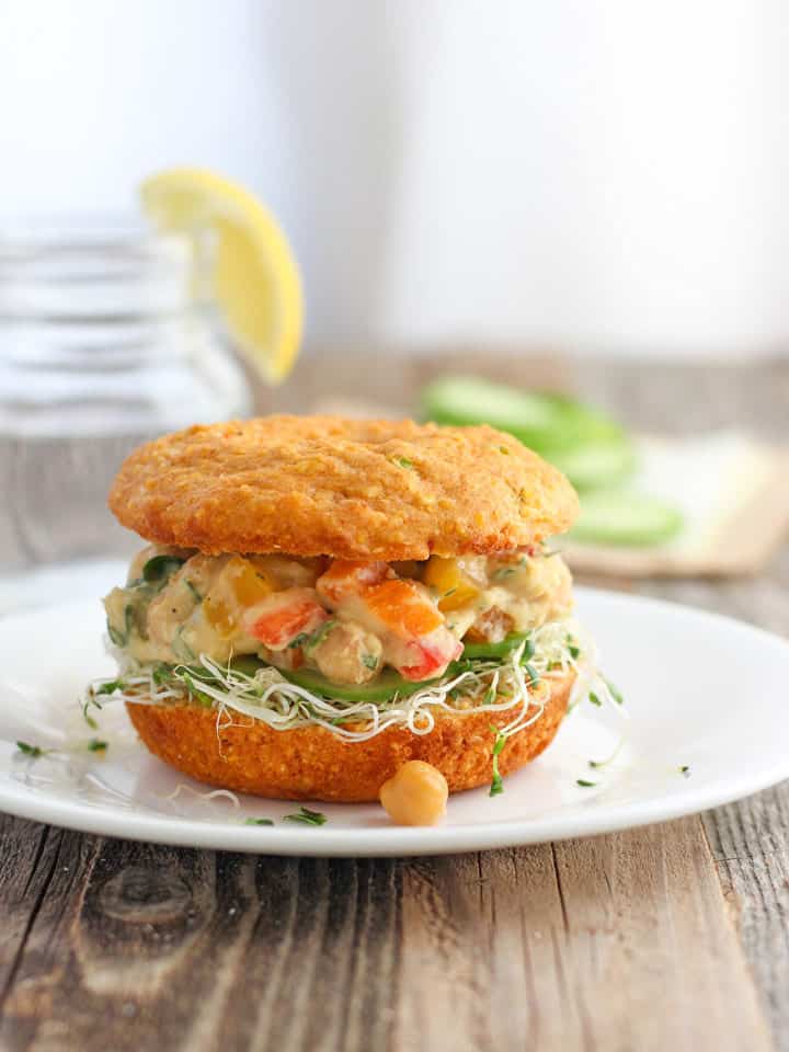 Chickpea salad sandwiched between two slices of hearty cornbread.