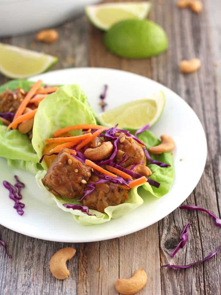 Lettuce wraps on a white plate.