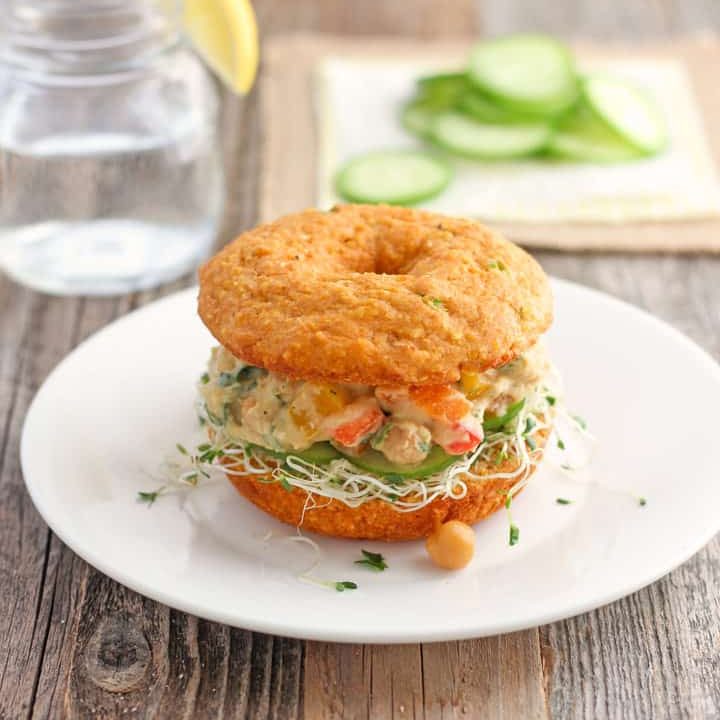 A chickpea salad sandwiched between two slices of hearty cornbread.