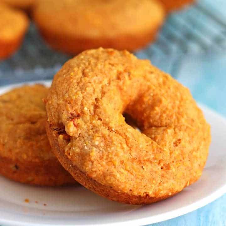 Vibrant orange cheddar sriracha cornbread donuts.