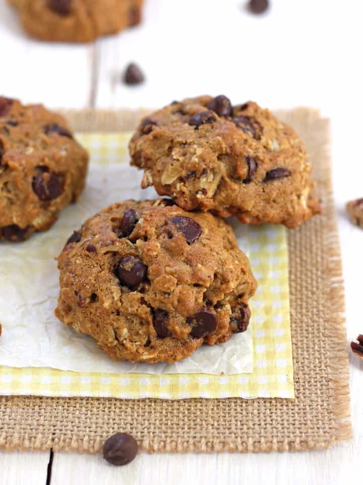 Chocolate chip oatmeal cookies on a yellow napkin.