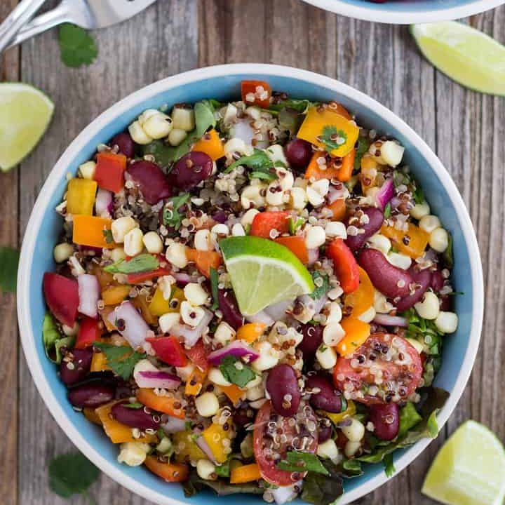 Overhead view of bowls of colorful salads..