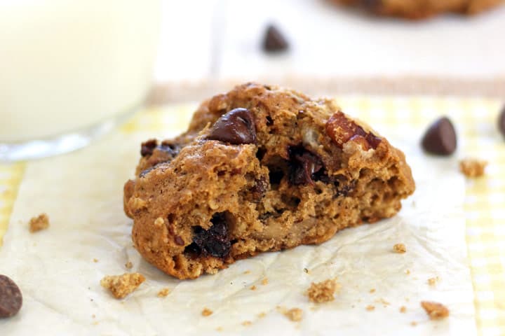 Closeup of cookie interior with melty chocolate and crunchy pecans.