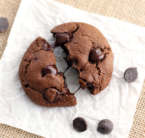 Chocolate cookie on a piece of parchment.