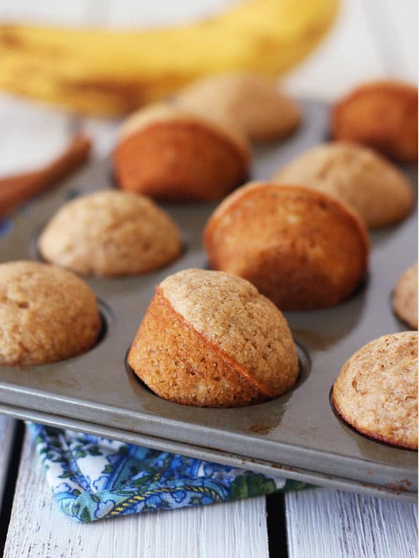 mini muffins propped on their sides in a mini muffin pan