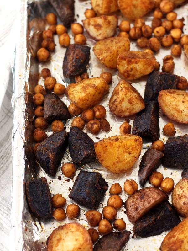 Roasted baby potatoes and chickpeas on a sheet pan. 