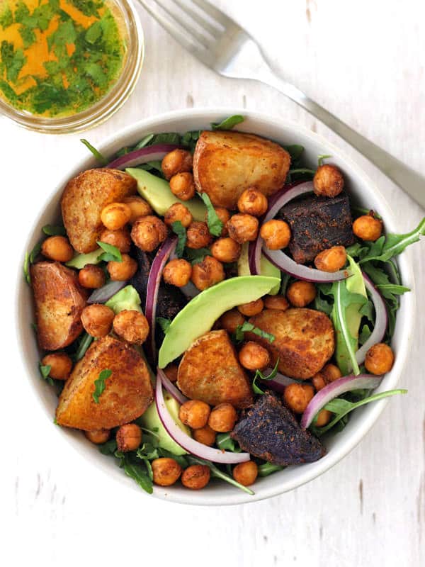 Overhead view of salad with chickpeas, potatoes, and avocado.