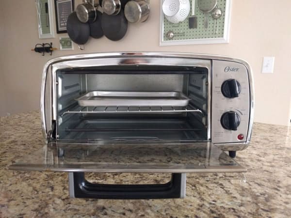 Oster TSSTTVVGS1 toaster oven on a kitchen counter.