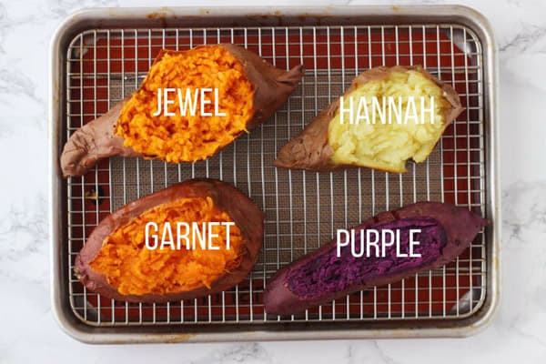 Baked Garnet, Jewel, Hannah, Purple sweet potatoes on a baking rack