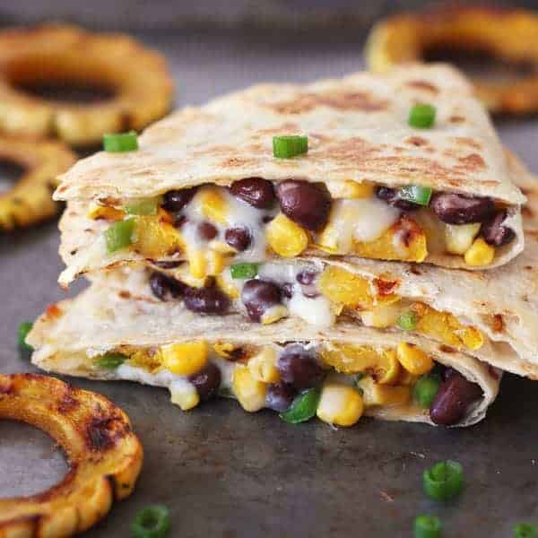 Cooked and sliced quesadilla on a baking sheet