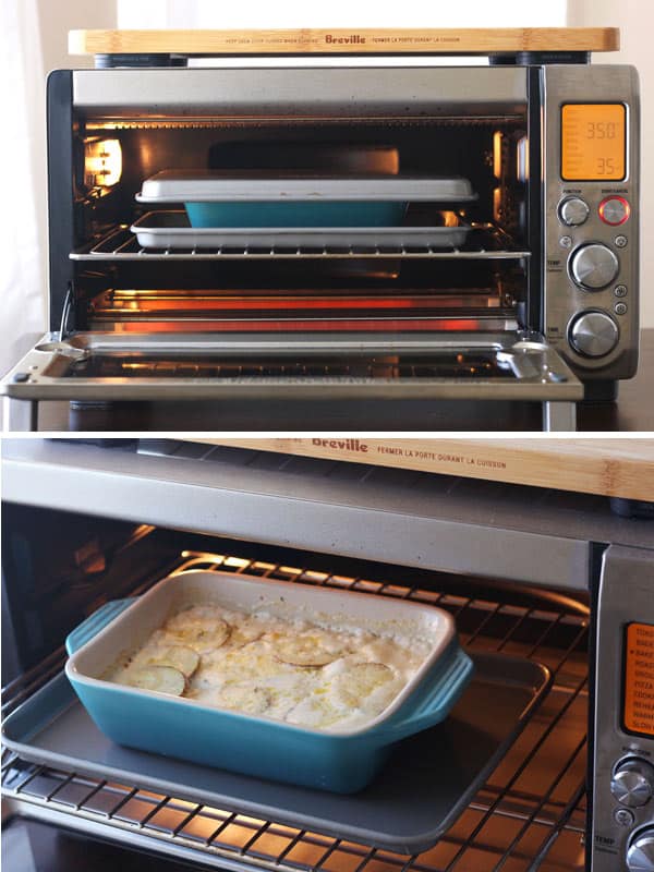 A dish of potatoes au gratin baking in the toaster oven.