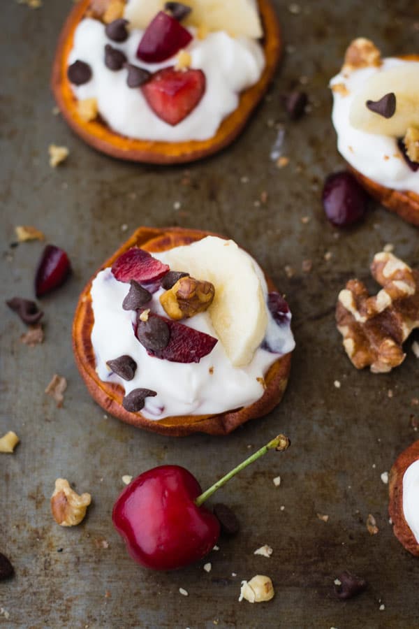 Sweet potato slices topped with yogurt, cherries, and banana slices.