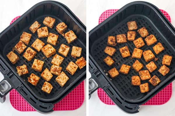 Squares of tofu in an air fryer basket.