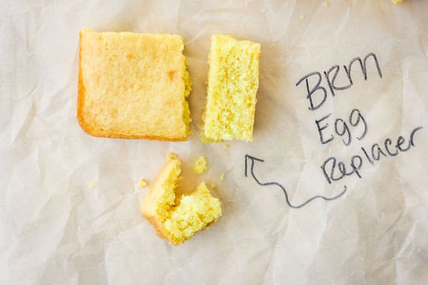 Pieces of yellow of cake with text BRM Egg Replacer.