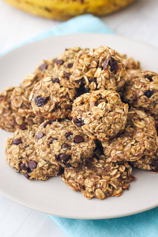 Plate of banana oat cookies on a blue napkin.