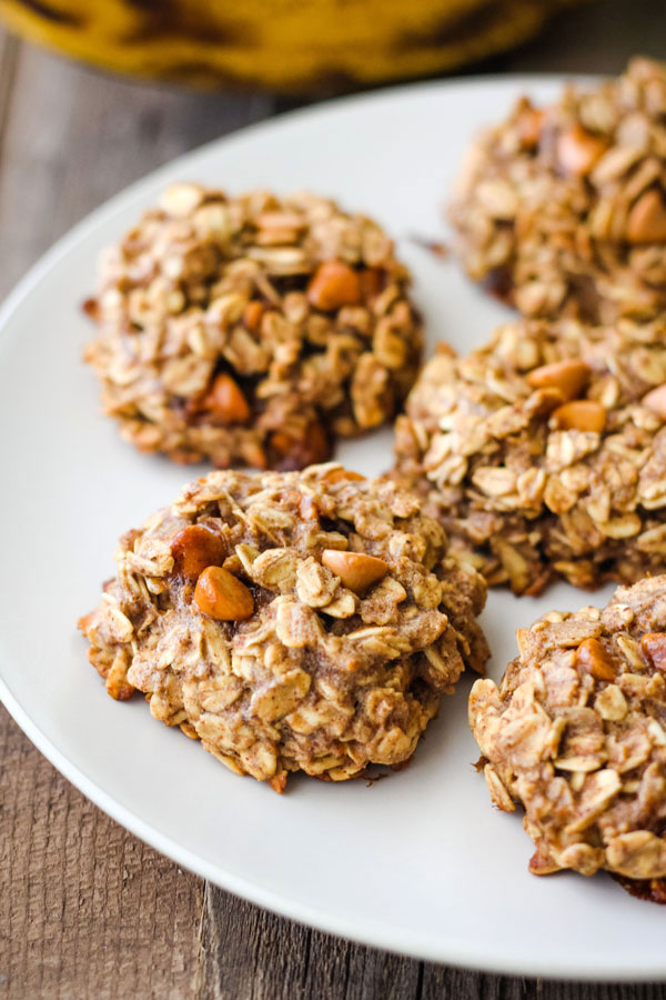 Closeup of banana oatmeal cookies on a white plate.