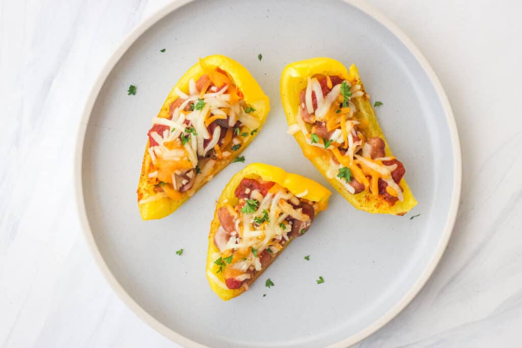 Yellow bell pepper strips topped with beans and cheese.