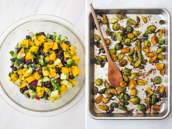 A glass bowl of avocado mango salsa and a sheet pan of roasted Brussels sprouts.