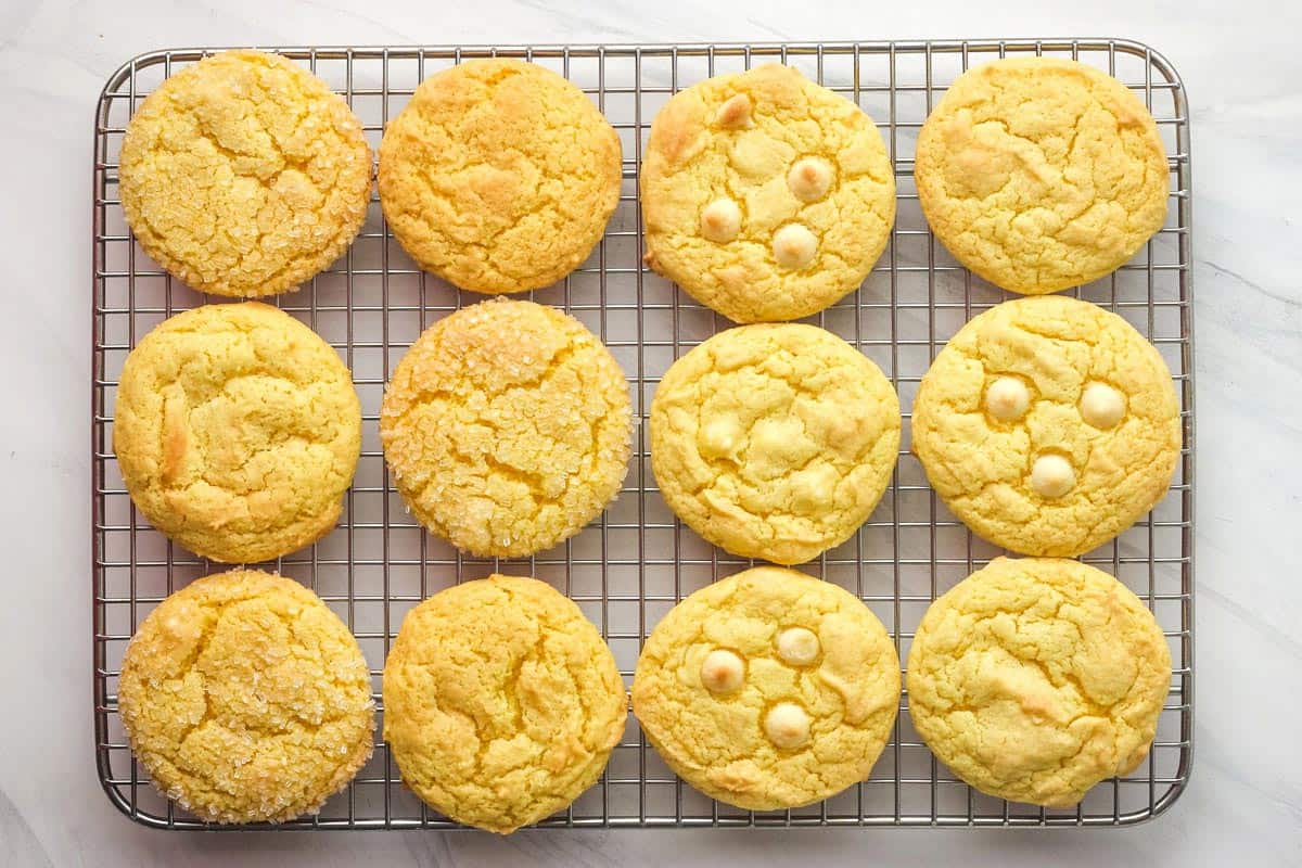 Baked lemon cake mix cookies cooking on a wire rack.