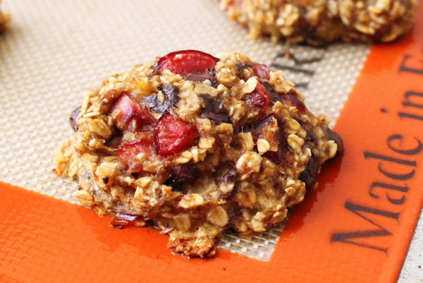 Cherry banana cookie on a silicone baking mat. 