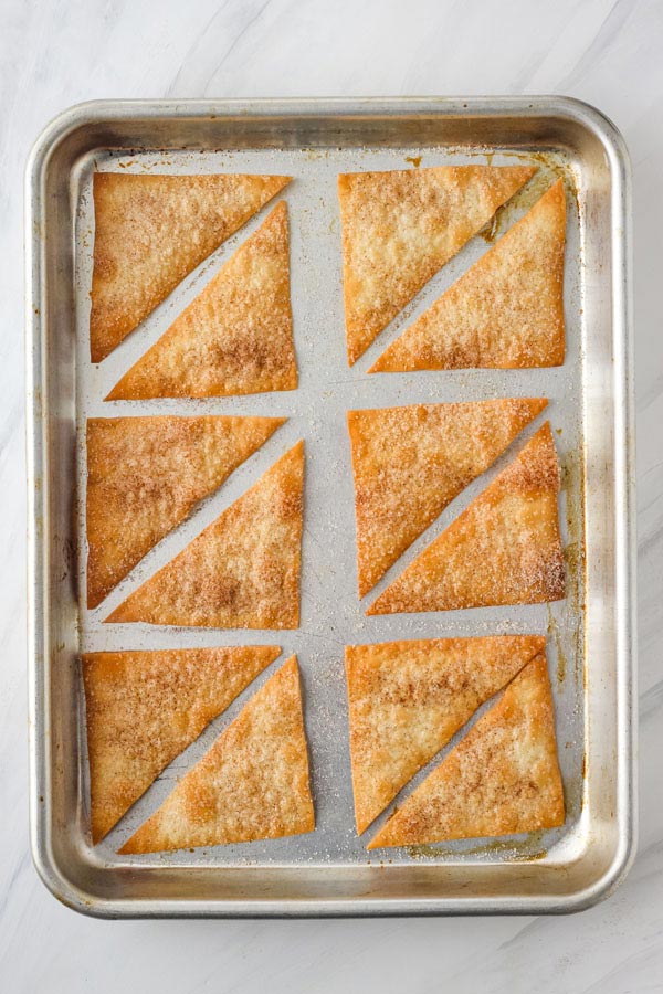 Baked Wonton Chips on a quarter sheet pan.